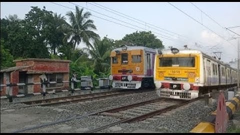 Crossing : Different Model EMU Local Trains at busy Railgate