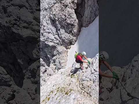 Climbing the famous via ferrata through the giant Front Window on Mount Prisojnik (2547m)