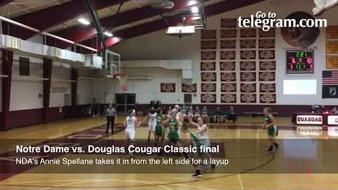 Notre Dame's Annie Spellane dribbles it in from th...