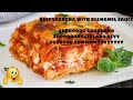 Beef lasagna with bechamel sauce topped with beef pepperoni slices