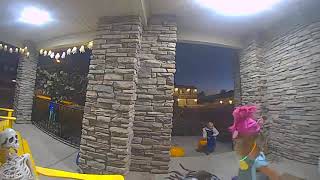 Little girl gets scared off by fake spider that jumps out at her while trick or treating