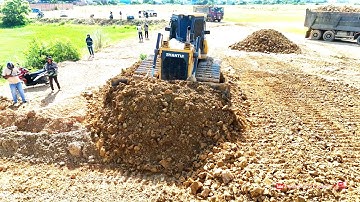 Great Bulldozer Shantui Pushing Soil With Hyundai Dump Trucks Dumping Soil Landfill Flood Land