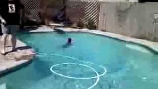 Spaz kid acts like turd, then gets thrown in pool