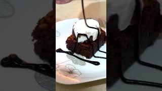 Hot brownie with ice cream and chocolate syrup