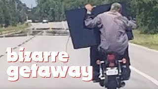 Bizarre Getaway: Thieves ride off on motorcycle with tv