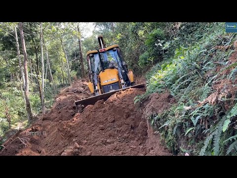 As soon as JCB Completed Smoothing Road-Vehicle Started Carrying Load through Road