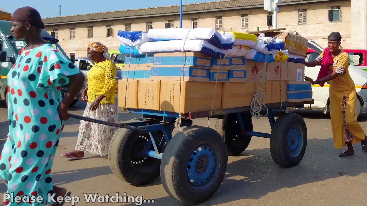 STREET SCENES IN EXTREMELY BUSY AFRICAN MARKET GHANA ACCRA