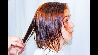 Bob haircut and new red copper color in a woman with careless hair