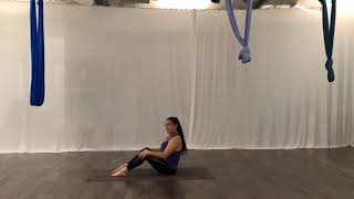Half Roll back with a Twist - Pilates Mat Exercise