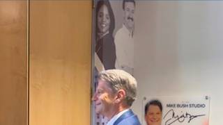 Mike Bush takes one final walk to the anchor desk as he signs off air
