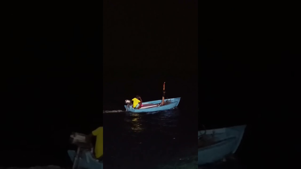 Late-night fishing on a tiny boat 