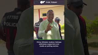 ELECTION DAY - Prime Minister Andrew Holness addresses supporters and media at polling station