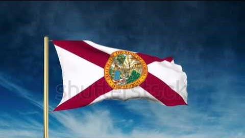 florida flag slider style. Waving in the win with cloud background animation Stock video by