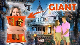 Handing Out Giant Bags Of Candy To Kids On Halloween