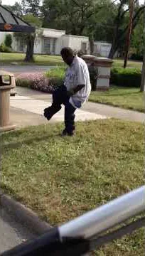 Crazy guy takes pants out of trash can