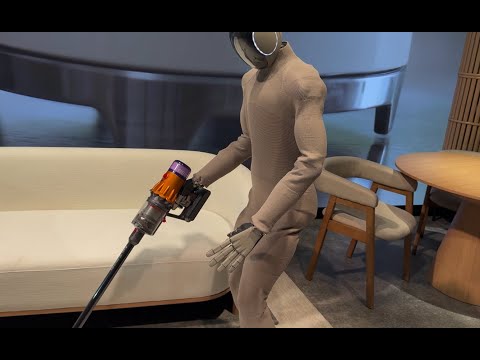The humans were mesmerized watching this robot clean the floors...