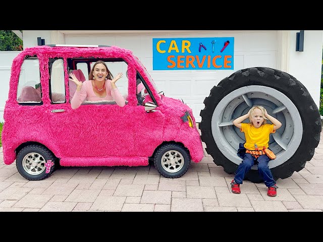 Chris helps Mom take care of pink car class=