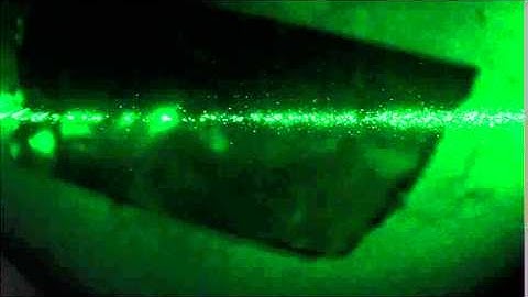 Particle becomes trapped by laser - Laser Trapping in Air