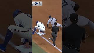 Fernando Cruz somehow gets the out at third base! 🤯