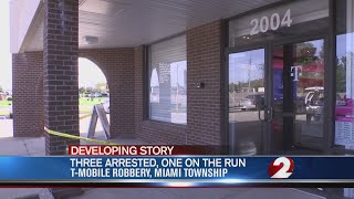 Three in custody, one on the run, after cell phone store robbery