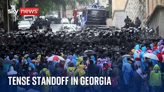 Georgia: Tense standoff on streets as protesters try to block MPs from entering parliament