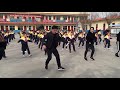 School principal shuffles as he leads students in dance routine