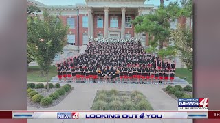 OSU band tries on new uniforms