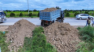 Nice video, nice skill bulldozer operator pushing soil filling with dump trucks 