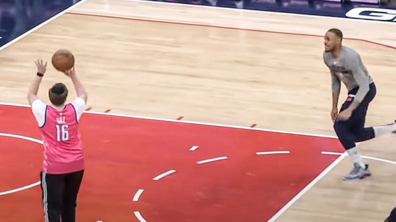 A fan throws lob to Daniel Gafford after pregame warmup NBA on ESPN