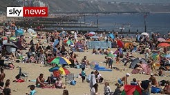 Thousands flock to beaches on UK's hottest day despite COVID-19 warnings