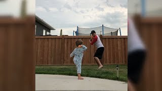 Young Boy Playing Baseball With His Father