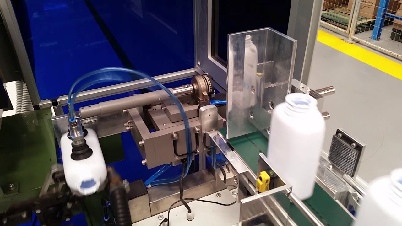 High Speed Automation- Pharmaceutical Bottle Handling System onto conveyor & then through inspection