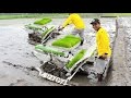 Two Wheel Tractor Rice Transplanter Working On Paddy Farm Field