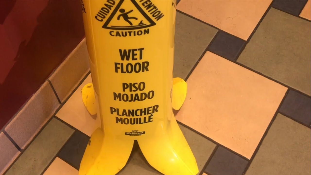 live free armory COOLEST floor is wet sign (looks like a BANANA PEEL) that’s funny