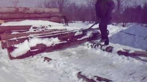 Loading a log onto the sawmill (Woodland Mills 122)