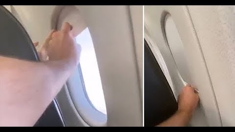 Passengers battle over closing or opening plane window shade