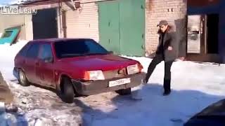 A Russian guy kicks a car and destroys it