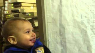 Artie laughs at dad at guitar work shop