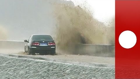 20-metre-high tidal bore wave lashes China power station