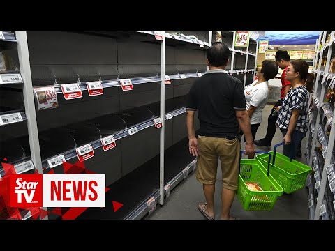 singapore-raises-virus-alert,-sparking-panic-buying-across-supermarkets