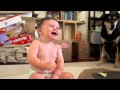 baby cracking up laughing