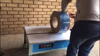 PW-90LS Low-table Outer adjustment semi-automatic strapping machine.