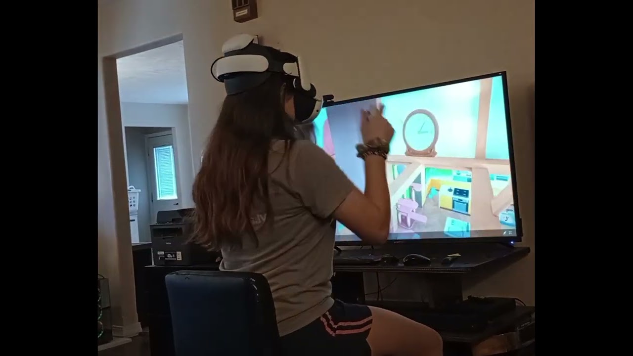 Sister two playing I Am Cat on VR