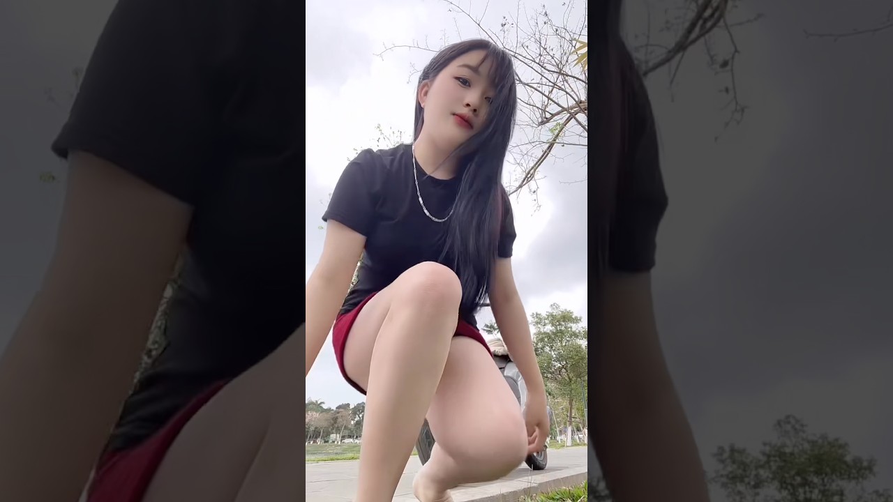 Vietnamese Beauty in Mini Skirt - Casual Street Style by the Scooter