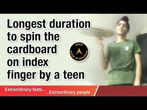 Longest duration to spin the cardboard on index finger by a teen