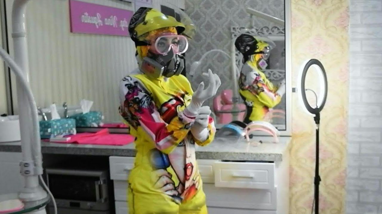 Indonesian dentist boosts patients' mood with colourful hazmat suits | AFP