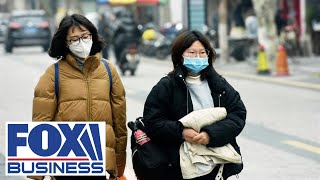Race to contain coronavirus ramps up as China restricts travel
