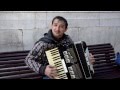 Street artist at Malaga playing Turkish March(Mozart) on accordion