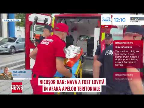 Rescuers moving an injured crew member on a stretcher in Euronews Romania coverage of the LPG tanker hit near Sfântu Gheorghe.