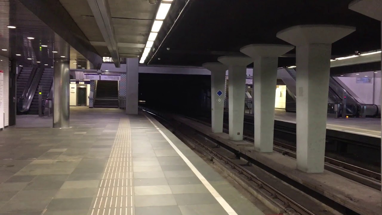 Metro line E arrives at metro station Beurs